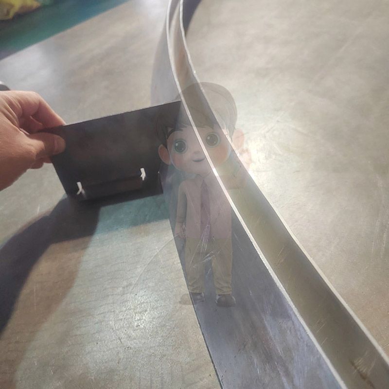 Tensile bending profiled material